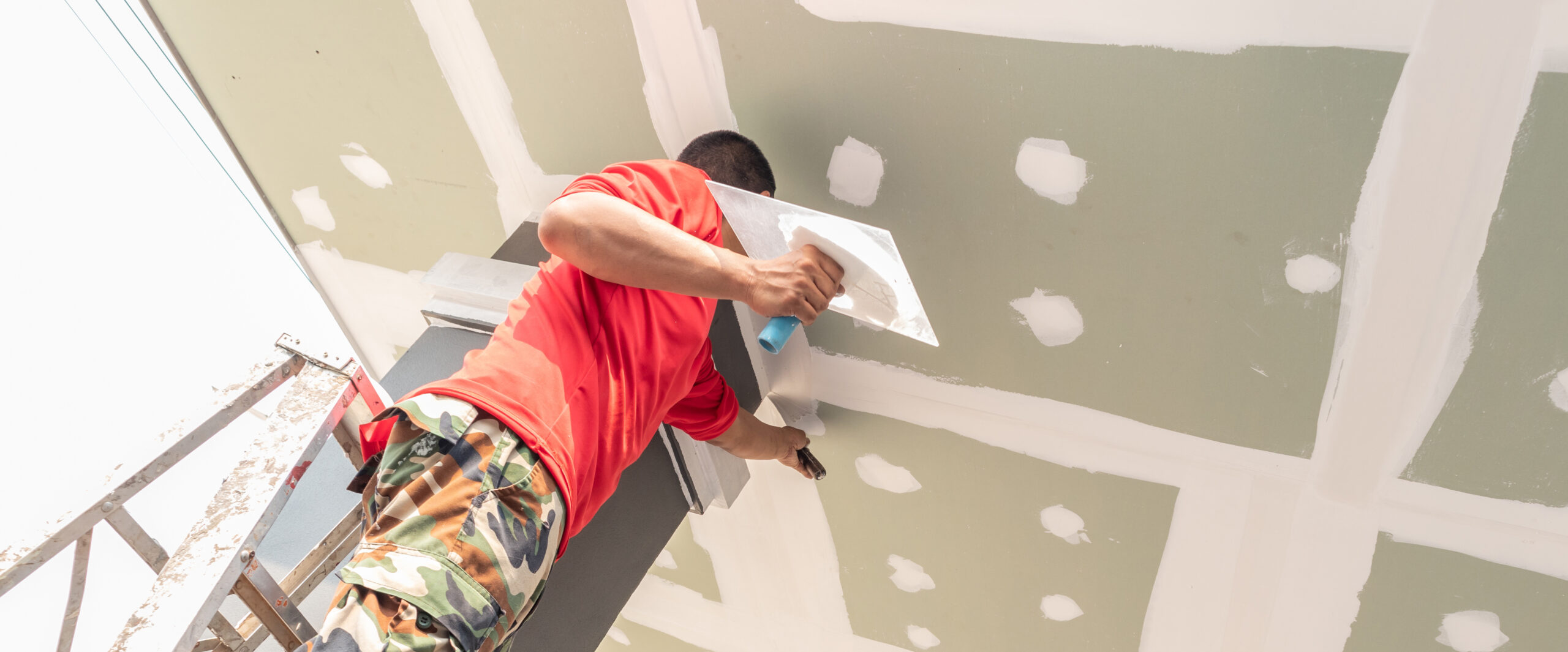 Construction worker are plastered a ceiling. Concept build a house